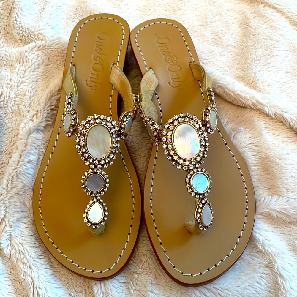 Ladies thong sandal, gold leather with embellishments . Like new size 9